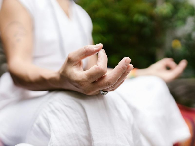 Close up of hands performing a precise yoga mudra
